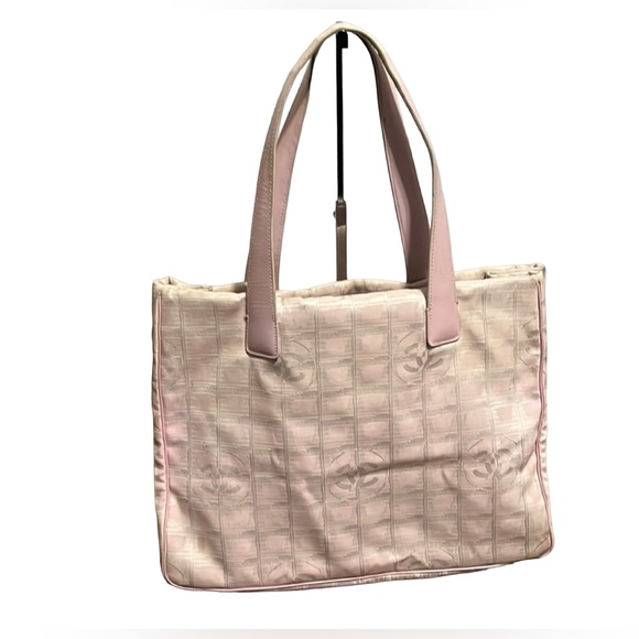 CHANEL Handbags - Authentic Chanel Travel Line Tote Pink Nylon
$2,500